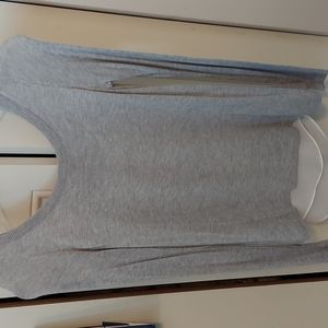 Small gray sweater with back cut revealing white sheer tank top attached